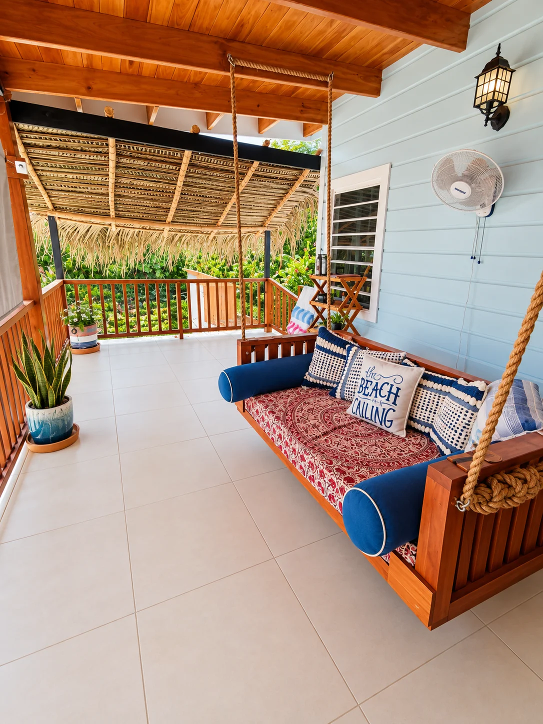 Covered veranda with porch swing and outdoor seating